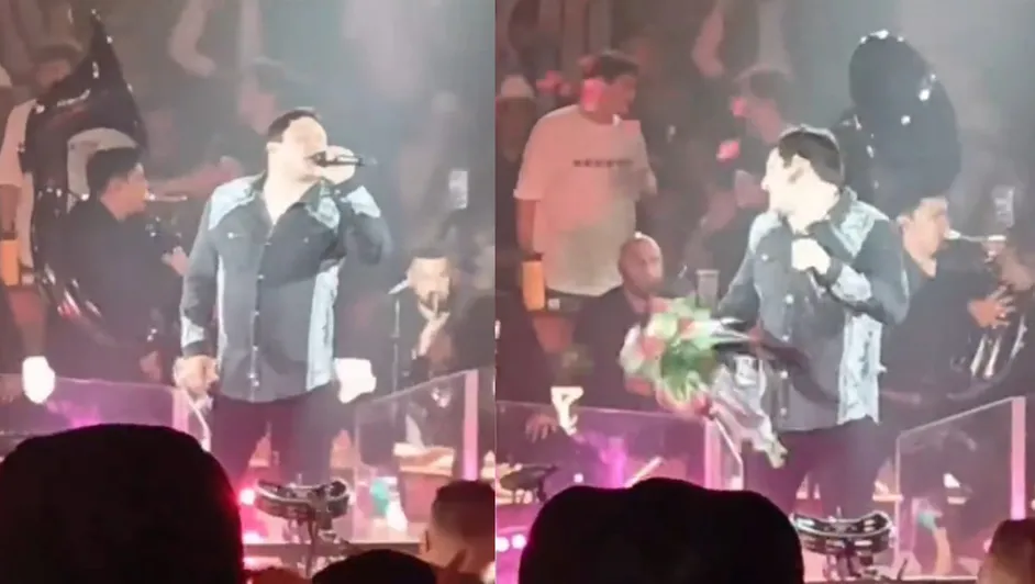 Un ramo de flores impacta el rostro de Julión Álvarez en pleno concierto