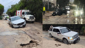 Autos terminan atrapados en zanjas inundadas de la avenida Colegios en Cancún